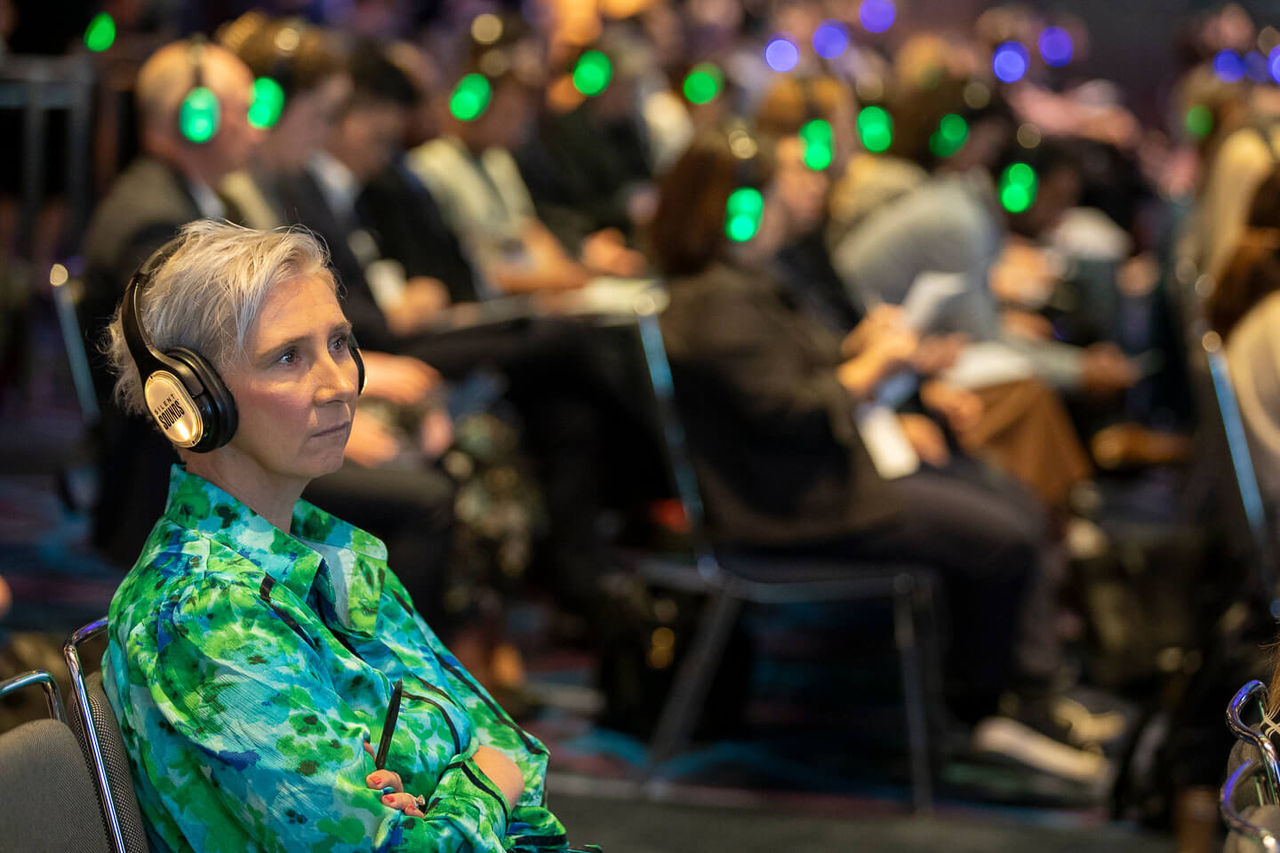 The attendees are listening to the panel